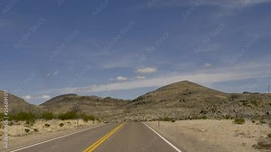 Drive Plate-Curving 2-lane Great Basin Highway, US Highway 93 through the Nevada desert-POV-View forward