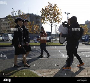 The Hakuhodo film team records a promotion video at Marine Corps Air Station Iwakuni, Japan, Nov. 29, 2016. Hakuhodo Inc. teamed up with the Japan Maritime Self-Defense Force to create a promotion video to show how the JMSDF is active in the community Stock Photo - Alamy