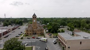 Tuskegee, Alabama downtown and Macon County, Alabama courthouse with drone video moving right to left.