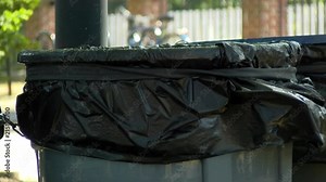 A good clean shot of garbage cans on a beautiful day. I like this shot for a documentary type of feel to show trash within a beautiful setting.