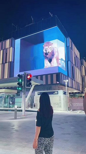 Interactive Lion Billboard in Modern Urban Night Scene