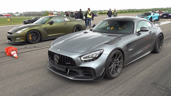Tuned cars prepare for drag race start