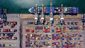 4k, Time lapse, Aerial view container ship carrying container in import export business logistic and transportation of international by container ship in the open sea.