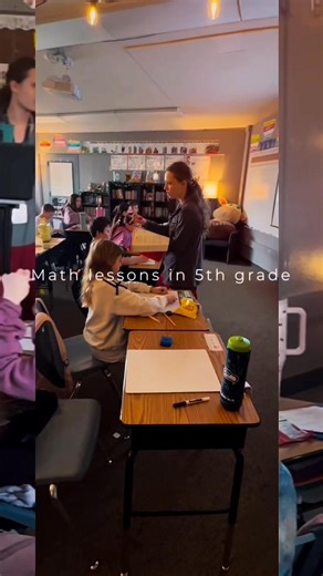 Developing math skills in Ms. Lydia Totey's fifth grade class was a time for building on foundational skills. This lesson was designed to review dividing with decimal numbers. Ms. Totey took care of her students by giving them a variety of learning environments to move through, such as solo work on a white board, collaboration with a desk friend, and group learning as a class. Ms. Totey gave instruction from the front and followed that by checking in individually with her students to make sure t