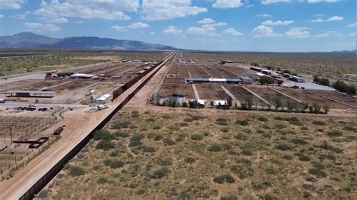 US-Mexico border wall painted black to hinder illegal crossings