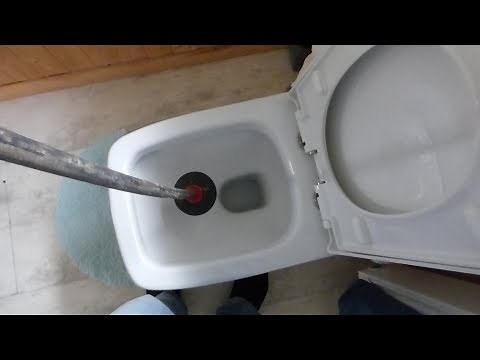 How to clear a blocked WC pan with a drain plunger rod