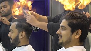 1M views · 410 shares | This Indian barber has an unusual technique to style his customers' hair by setting it on fire. Footage shot at a local salon in Hyderabad in Andhra Pradesh, India, shows a barber setting his client's hair alight and using two combs to give his hair a nice trim. | CGTN | Facebook
