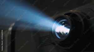 Working projector, equipment for conducting presentations, particles in a ray of light.