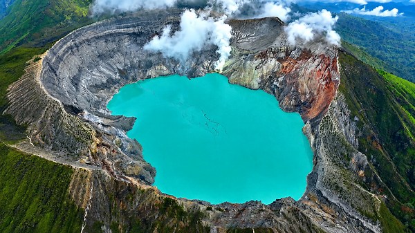 Kawah Ijen’s blue fire rising from the volcano crater