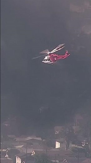 Helicopter performs water drops over commercial fire in Boyle Heights