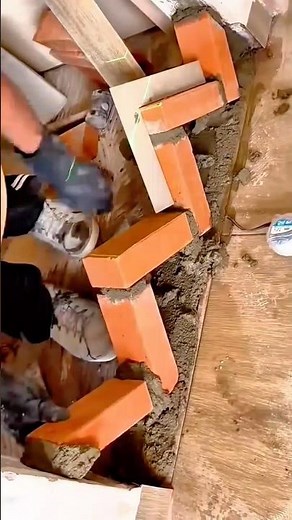 Precise brick corner alignment using laser level for accurate wall construction foundation