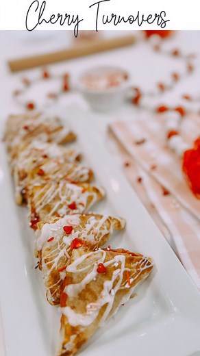 2 ingredient Cherry Turnovers with @pepperidgefarm puff pastry and cherry pie filling make the easiest dessert or sweetest breakfast treat for your loves!! ❤️ If you want to be extra, dress them up a bit with a powdered sugar glaze and some Valentine’s sprinkles. Tip : Let the puff pastry set out of the fridge about 2 hour before using it. Gently roll into a rectangle and cut with a pizza cutter into 9 even squares. Fill with a spoonful of cherry pie filling and pinch seams closed with fork. And