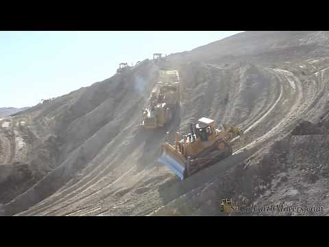 CAT 651 scrapers doing what they do