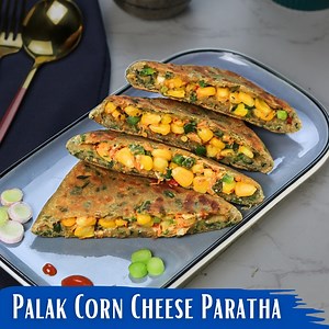 Banaye bahut sari hari bhari sabji aur palak se palak corn cheese lifafa paratha ki recipe ko jise aap shuba nasta mai ya bacho ke tiffin mein bhi de sakte hai. Ingredients: • 3 cups wheat flour • 1 and a half cups of spinach • 1 cup boiled corn • 1 teaspoon cumin seeds • 1 teaspoon carom seeds • ½ cup grated cheese • ½ cup finely chopped green capsicum • ½ cup grated carrot • ¼ cup finely chopped spring onion • 2 green chilies finely chopped • 1 teaspoon black pepper powder • 1 teaspoon chili f
