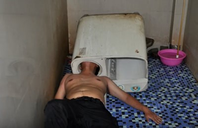 Man gets his head stuck in washing machine