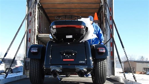 A behind-the-scenes look as our incredible crew loads in a new motorcycle. | Woodstock Harley-Davidson