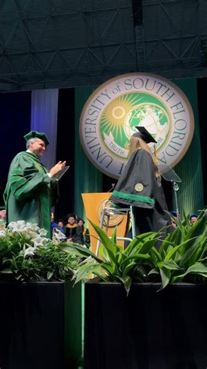 USF graduate rises from wheelchair at Commencement