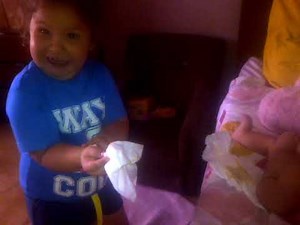 HILARIOUS! Sister changing baby brother's diaper