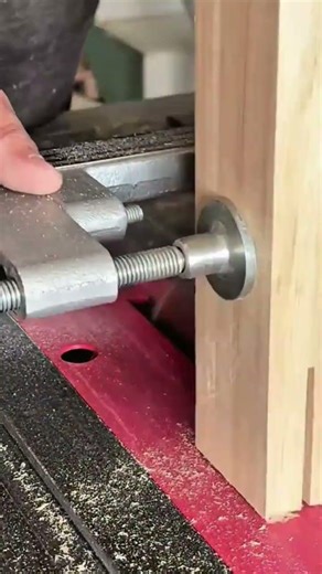 cutting a vertical slot into a thick wooden block using a table saw for making joinery projects