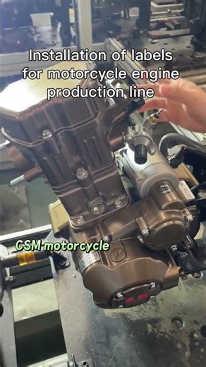 Installation of labels for motorcycle engine production line #motorcycle #tricycle #gasolineengine