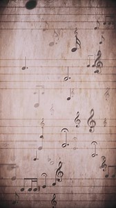 Download Vertical video - vintage sheet music notation manuscript with staff lines and musical notes moving gently across the sheet. This retro, grunge styled motion background is a seamless loop. for free
