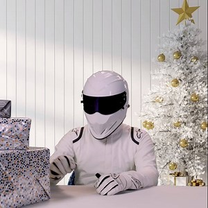 The Stig trying to guess his presents this morning... what did you get? Merry Christmas 🎄 🎁 | The Stig