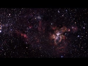 Zoom into The Eta Carinae Nebula & Supergiant Star | ESO FriendsofNASA.org: This animation zooms in on the massive star Eta Carinae in the European Southern Observatory/WFI image of the Eta Carinae Nebula. The Eta Carinae Nebula is located in the Carina–Sagittarius Arm of the Milky Way galaxy, approximately 8,500 light-years from Earth. Within the Carina Nebula is the supergiant star Eta Carinae. It has a mass about 100 times greater than our Sun. It is an excellent candidate for a future supern
