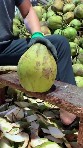Coconut Processing Techniques: Expert Worker in Action