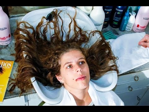 Washing and massaging the long, long hair of two young women