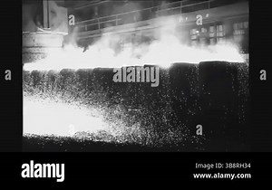 MICHIGAN - 1952 - Close-ups of steel workers show a huge crane removing an ingot from the soaking pit, highlighting the teamwork and machinery involved in steel production Stock Video Footage - Alamy