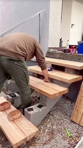 Wooden plank stair installation process for house terrace