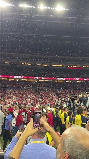 Fernando Mendoza, Aiden Fisher lead Lucas Oil Stadium in the IU fight song after winning the Big Ten