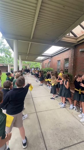 St. George Catholic School on Instagram: "One last walk, a lifetime of memories! The St. George 8th grade class makes their final exit after exams—cheered on by their adorable 2nd grade buddies. A heartwarming tradition that celebrates growth, friendship, and new beginnings!"
