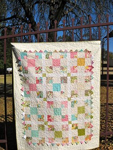 Reversible quilt: disappearing nine patch variation with prairie points and rubik’s cube inspired back