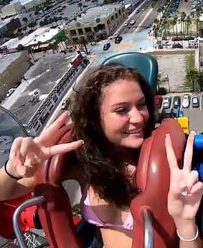 Slingshot ride. She have well-rounded breasts