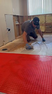 Installing the uncoupling membrane in the master bathroom #tile #homeimprovement #diy | KLK Builds