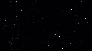 Golden bokeh particles glowing transition on alpha background in 4k