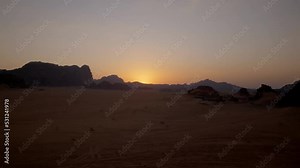 Time-lapse of a beautiful sunset in Jordan desert of Wadi Rum with the red rocks in the background