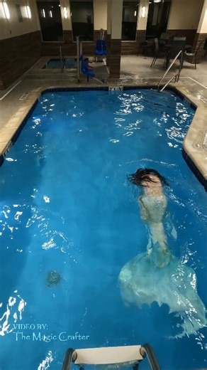 A mermaid with a glistening tail of white swims around in a pool 🖤 This is a longer video of our Moonflower Mermaid character in action! Moonflower lives swimming in pools because they generally have no algae. As a rather prissy princess, she doesn't like algae and avoids it like the plague! 😉🖤 Please enjoy this pool Mermaid video! #themagiccrafter #mermaid #moonflowermermaid #mermaidpool #professionalmermaid | The Magic Crafter