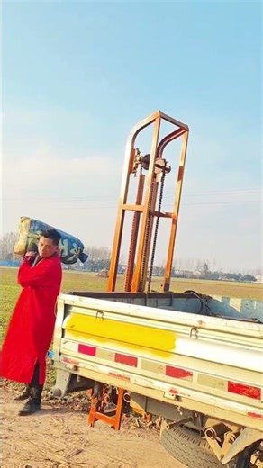 Farm Chore Efficiency: Unloading Hay Bales with a Truck-Mounted Lift