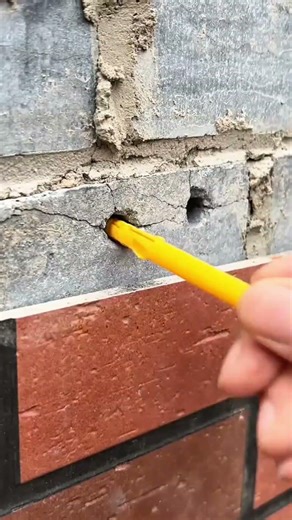 installing decorative brick wall panels using a drill and mortar injection tool for a stylish
