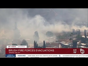 Forward spread stopped in Spring Valley brush fire; evacuation order shifted to warning