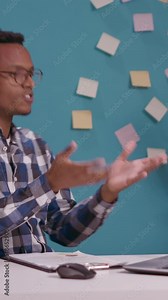 Vertical video: Call center operator fighting and yelling at customer on phone line, using headphones with microphone. Client care employee feeling angry and shouting at person, telemarketing support