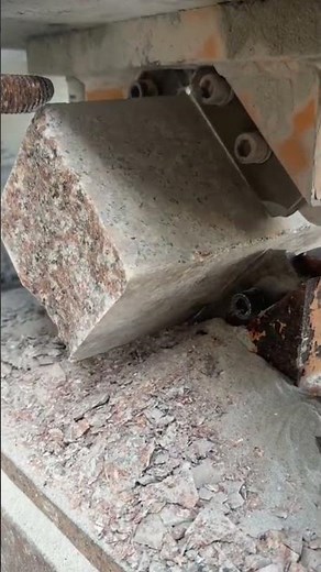 cutting a square piece of cement using a special cutting tool