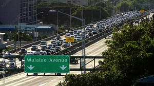 Daily morning westbound traffic from Hawaii Kai lines up on the H-1 Freeway in Honolulu, Hawaii Stock Video
