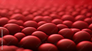 Closeup of textured rubber A detailed view of red rubber with a raised dot pattern. The texture is slightly soft to the touch but still offers ample friction.