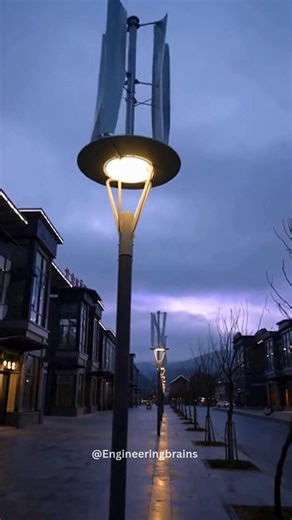 China is deploying street lights powered by compact vertical wind turbines, allowing public lighting to operate using wind instead of electricity from the grid. Unlike solar panels, these systems continue working day and night — even during cloudy weather. • The lamps use vertical-axis wind turbines, which can capture wind from any direction. • They generate electricity even at low wind speeds, common in urban environments. • Power is stored in built-in batteries to keep lights running overnight