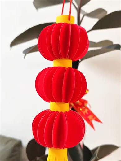 New Year's Day is almost here! Make a string of red lanterns with your child it's simple and beautiful. Give it a try! #origami #papercraft #tutorial #paper #crafts