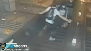 Caught on video: Man kicks woman down subway escalator
