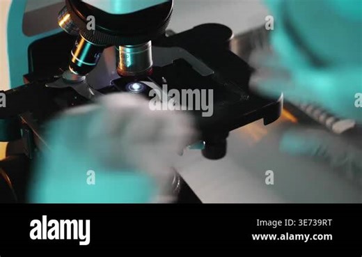 Close up of lab technician replacing glass slide under microscope during scientific analysis and sample preparation in laboratory environment Stock Video Footage - Alamy